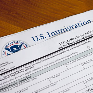 U.S. immigration and asylum application on a table - Robinett Law PLLC