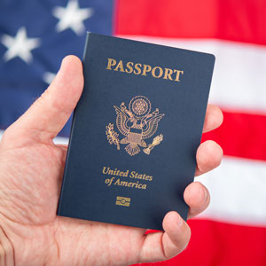 US Passport Held in Hand, Symbolizing Naturalization